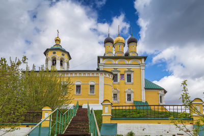 Low angle view of building against cloudy sky