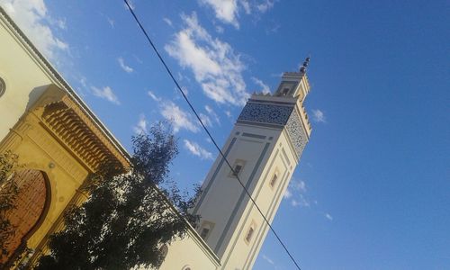 Low angle view of buildings against blue sky