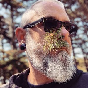 Close-up portrait of man wearing sunglasses