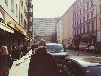 People walking on road in city