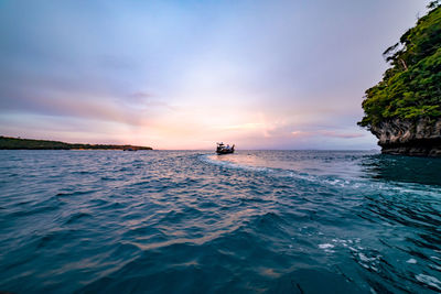 View of ship sailing in sea against sky