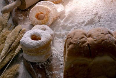 Picture of doughnuts with icing sugar on wooden table,food concept.