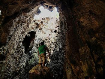 Woman standing on rock formation