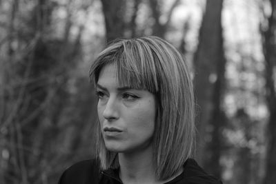 Portrait of a young woman looking away