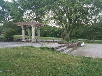 Gazebo by trees against sky