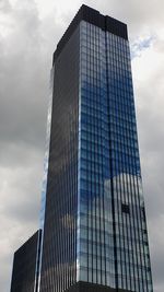 Low angle view of skyscraper against sky