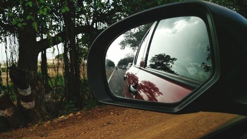 Reflection of car in rear view mirror