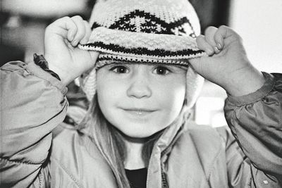 Close-up portrait of innocent girl in knit hat