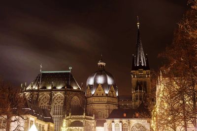 Low angle view of illuminated cathedral against sky at night