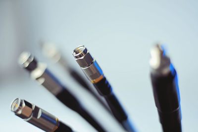 Close-up of pen on table against white background