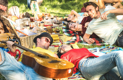 Friends enjoying picnic at park