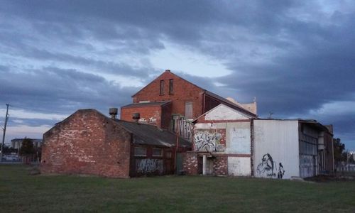View of buildings against cloudy sky