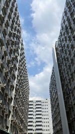 Low angle view of modern buildings against sky