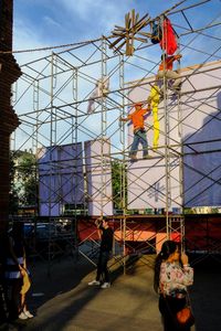 Low angle view of construction site against sky in city