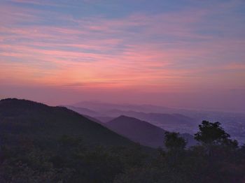 Scenic view of mountains against sky during sunset