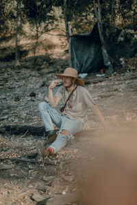 Full length of a young woman in the forest