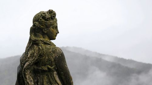 Low angle view of statue against sky