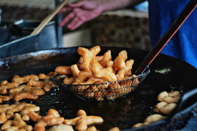 Cropped image of person preparing food