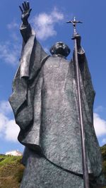 Low angle view of statue against sky