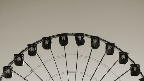 Low angle view of amusement park ride against sky