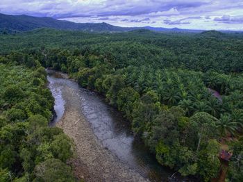 Scenic view of waterfall against sky