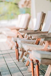 Close-up of empty chairs on table