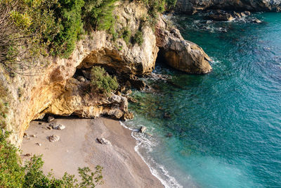 High angle view of rock formation on sea