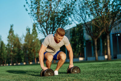 Full length of man exercising at park