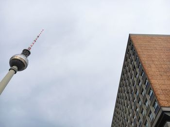 Low angle view of fernsehturm against sky