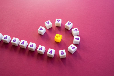 High angle view of pills on yellow background