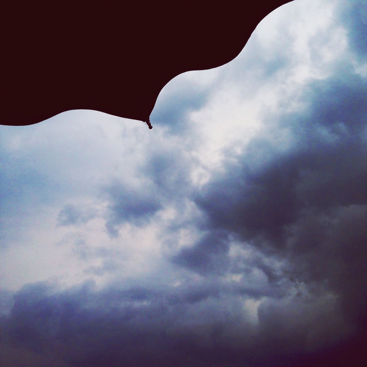 sky, cloud - sky, low angle view, cloudy, cloud, weather, cloudscape, overcast, beauty in nature, nature, scenics, tranquility, tranquil scene, dramatic sky, silhouette, outdoors, day, dusk, storm cloud, no people