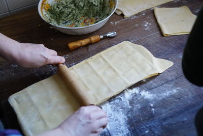 High angle view of person preparing food on cutting board