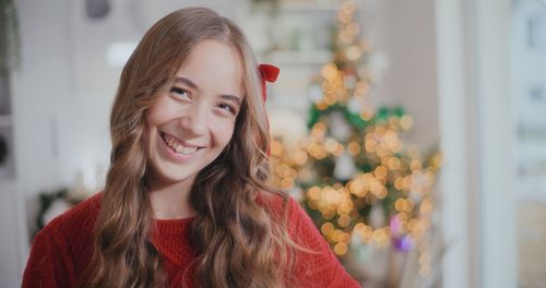 Portrait of smiling young woman looking away