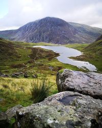 Scenic view of lake and mountain in snowdonia. 