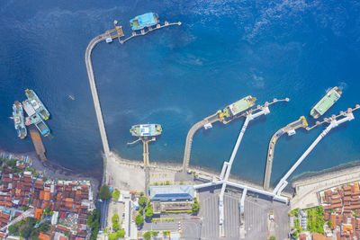 High angle view of amusement park by sea