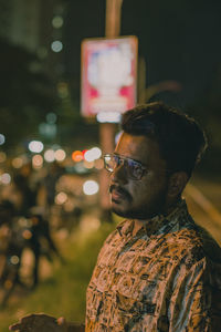 Portrait of young man looking away