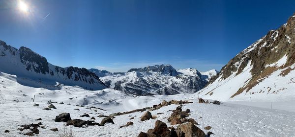 Scenic view of snowcapped mountains against sky