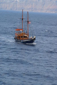 Sailboat sailing in sea against sky