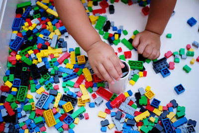 High angle view of baby playing with toy