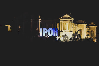 Illuminated building at night