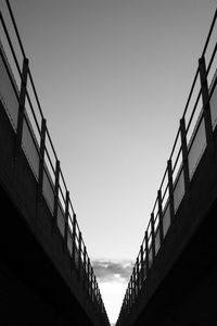 Low angle view of silhouette bridge against sky