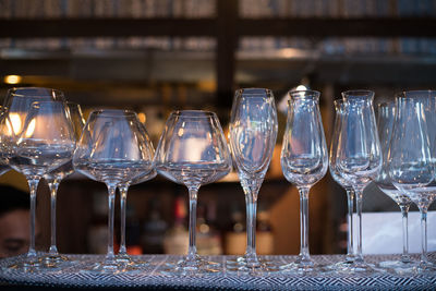 Close-up of wine glasses on table