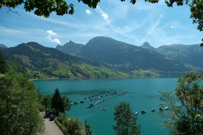 Scenic view of lake and mountains against sky