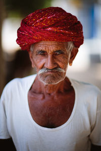 Close-up portrait of smiling mid adult man