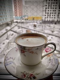 Close-up of coffee cup on table