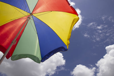 Low angle view of umbrella against sky