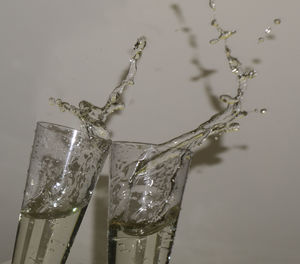 Close-up of wine glass against white background