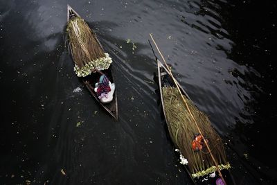 High angle view of man sailing boat on river