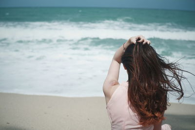 Close-up of young woman on beach