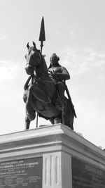 Low angle view of statue against sky